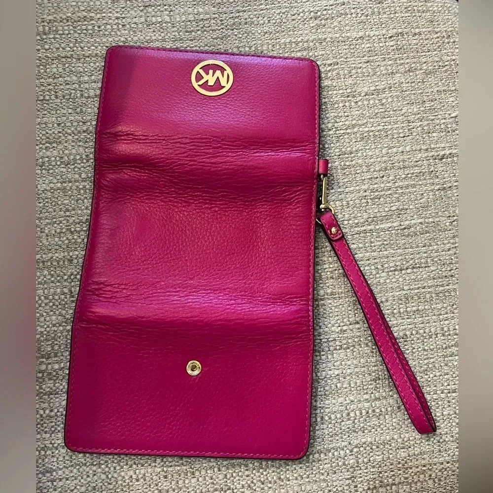Michael Kors fuchsia multi function wristlet